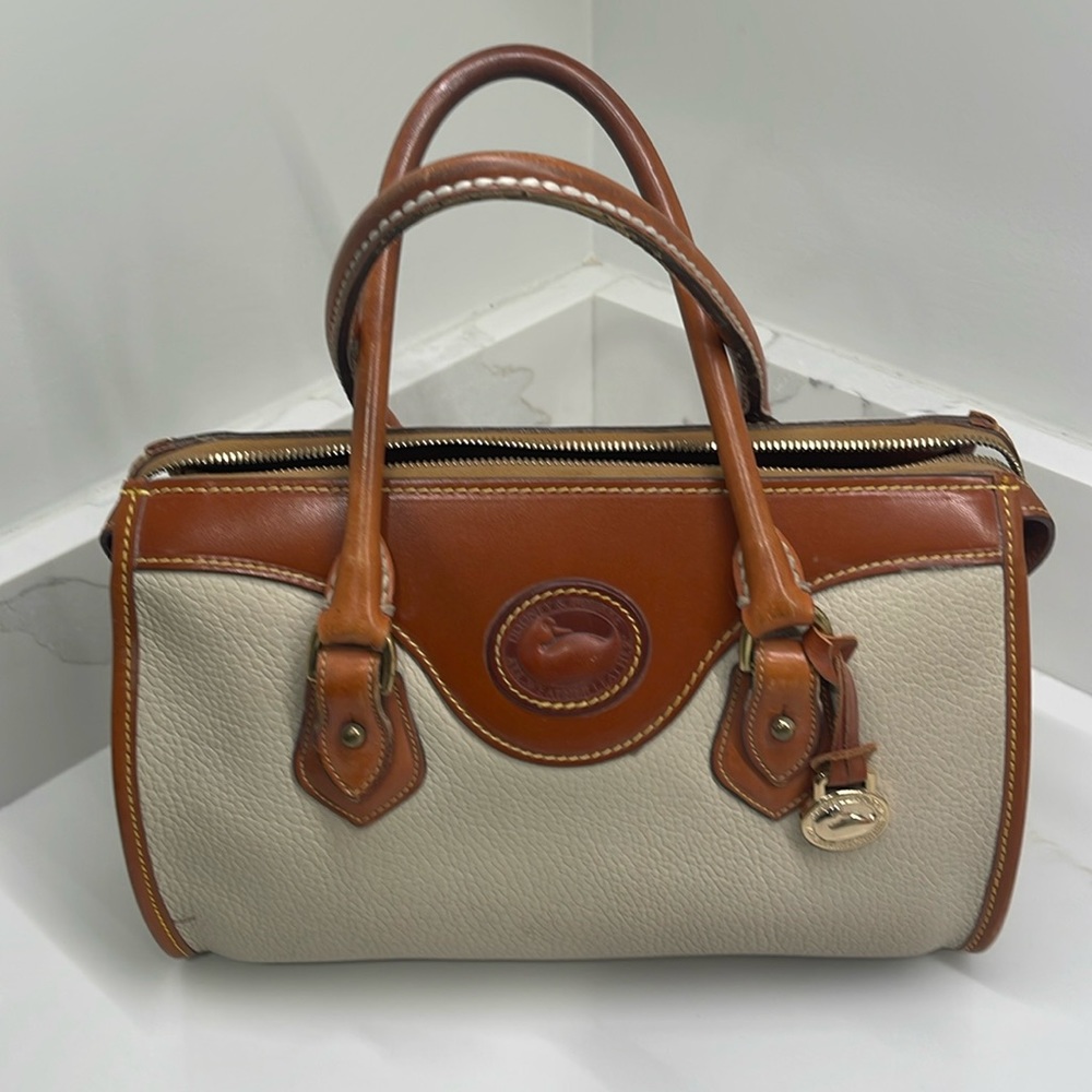 Dooney & Bourke bone colored satchel handbag.